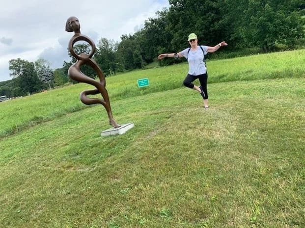Hands holding a glowing light bulb symbolizing faith and hope